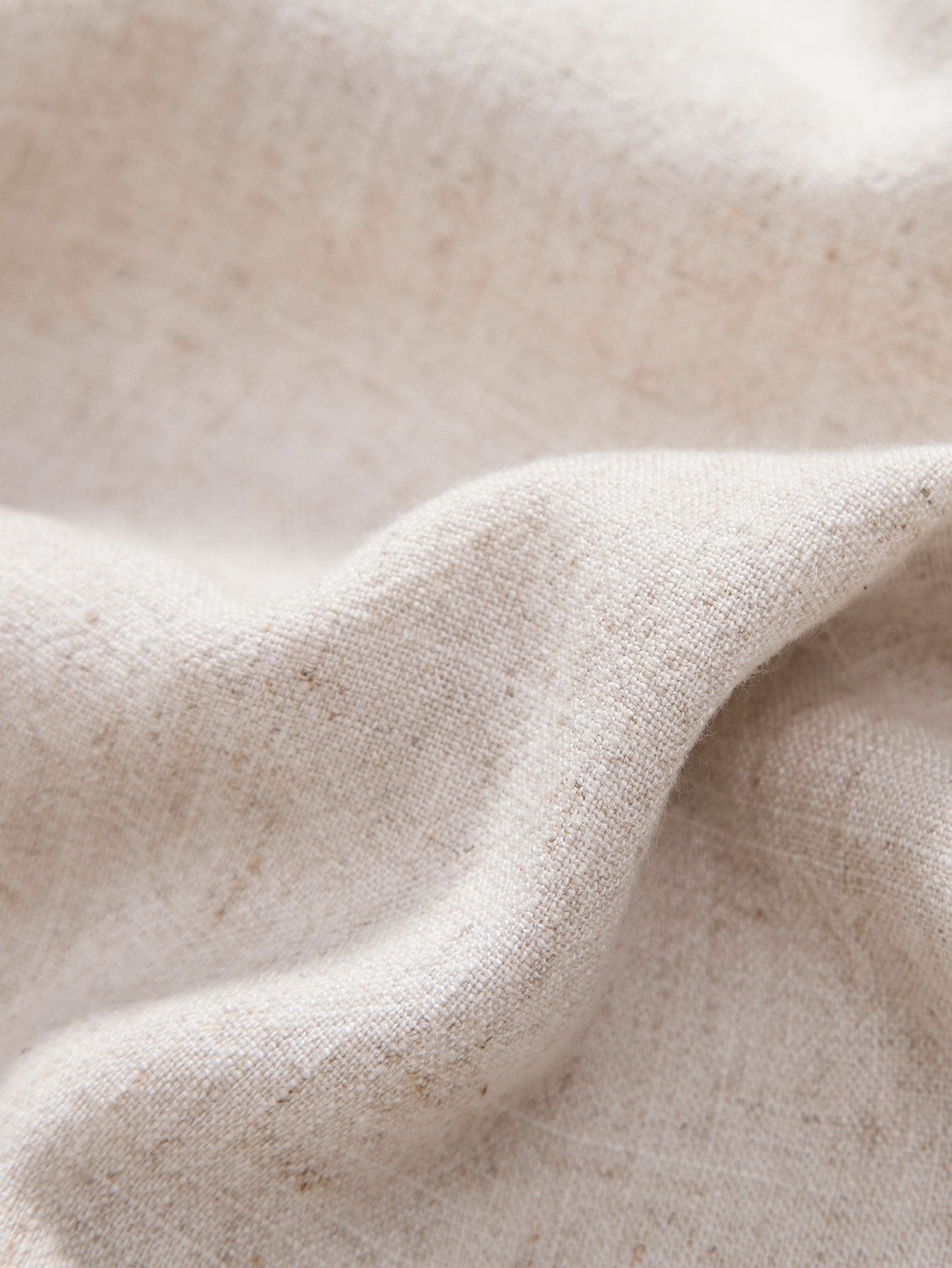 Close-up of beige fabric with a soft texture