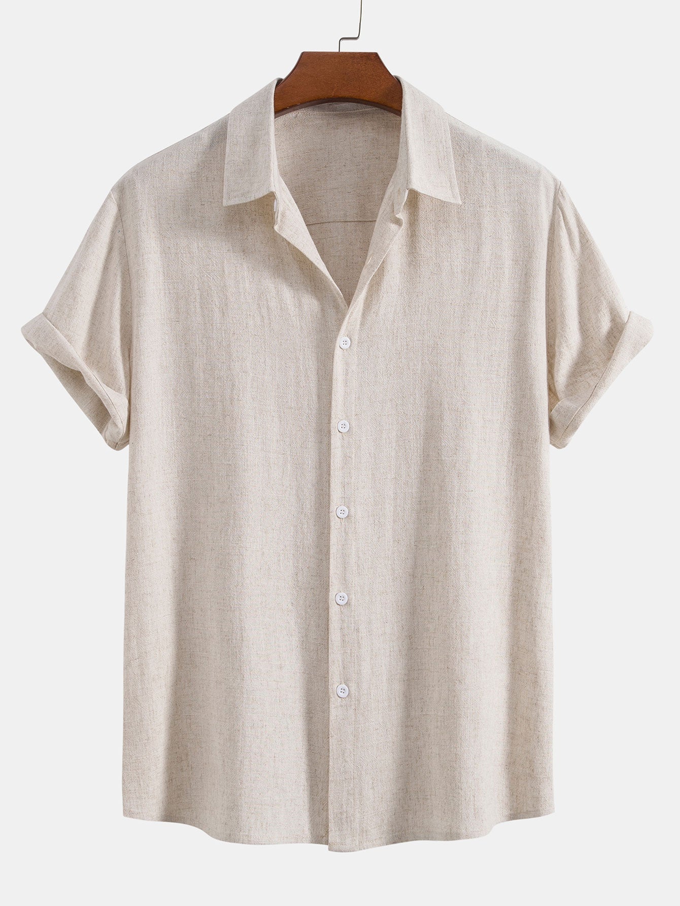 Beige short-sleeve shirt on a hanger against a white background