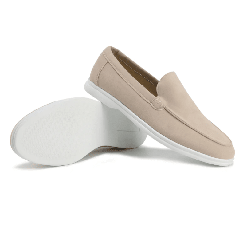 Beige loafers with white soles on a white background