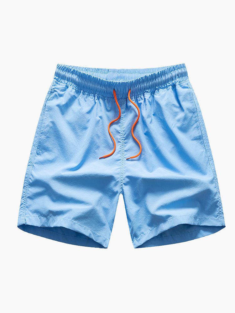 Blue swim shorts with orange drawstring on a white background