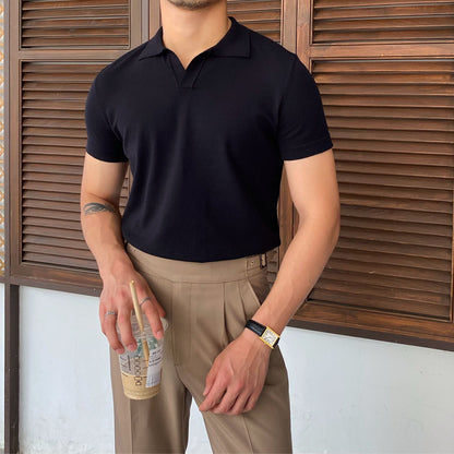 Premium black slim-fit cotton polo with a buttonless V-neck design, showcasing a smooth, high-end knit texture.