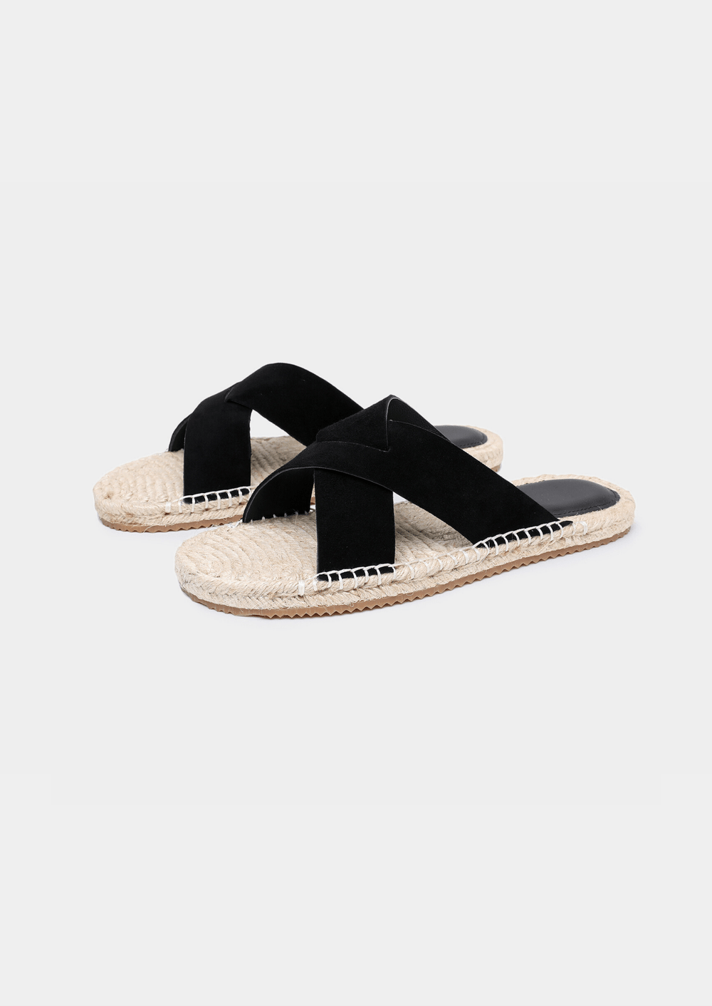 Minimalist black sheep suede sandals with a textured jute sole edge and comfortable everyday fit.