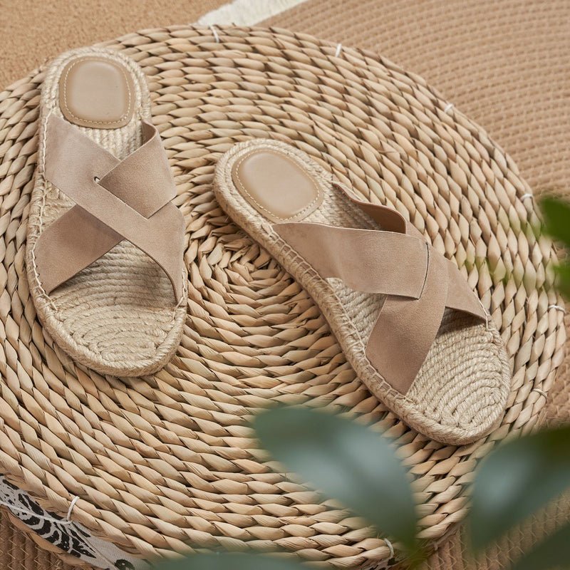 Men's beige sheep suede sandals featuring a braided jute trim and a modern open-toe silhouette.