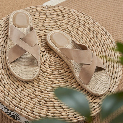 Men's beige sheep suede sandals featuring a braided jute trim and a modern open-toe silhouette.