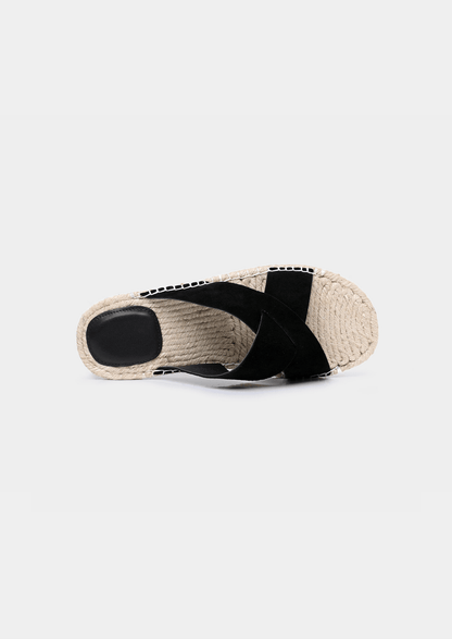 Minimalist black sheep suede sandals with a textured jute sole edge and comfortable everyday fit.