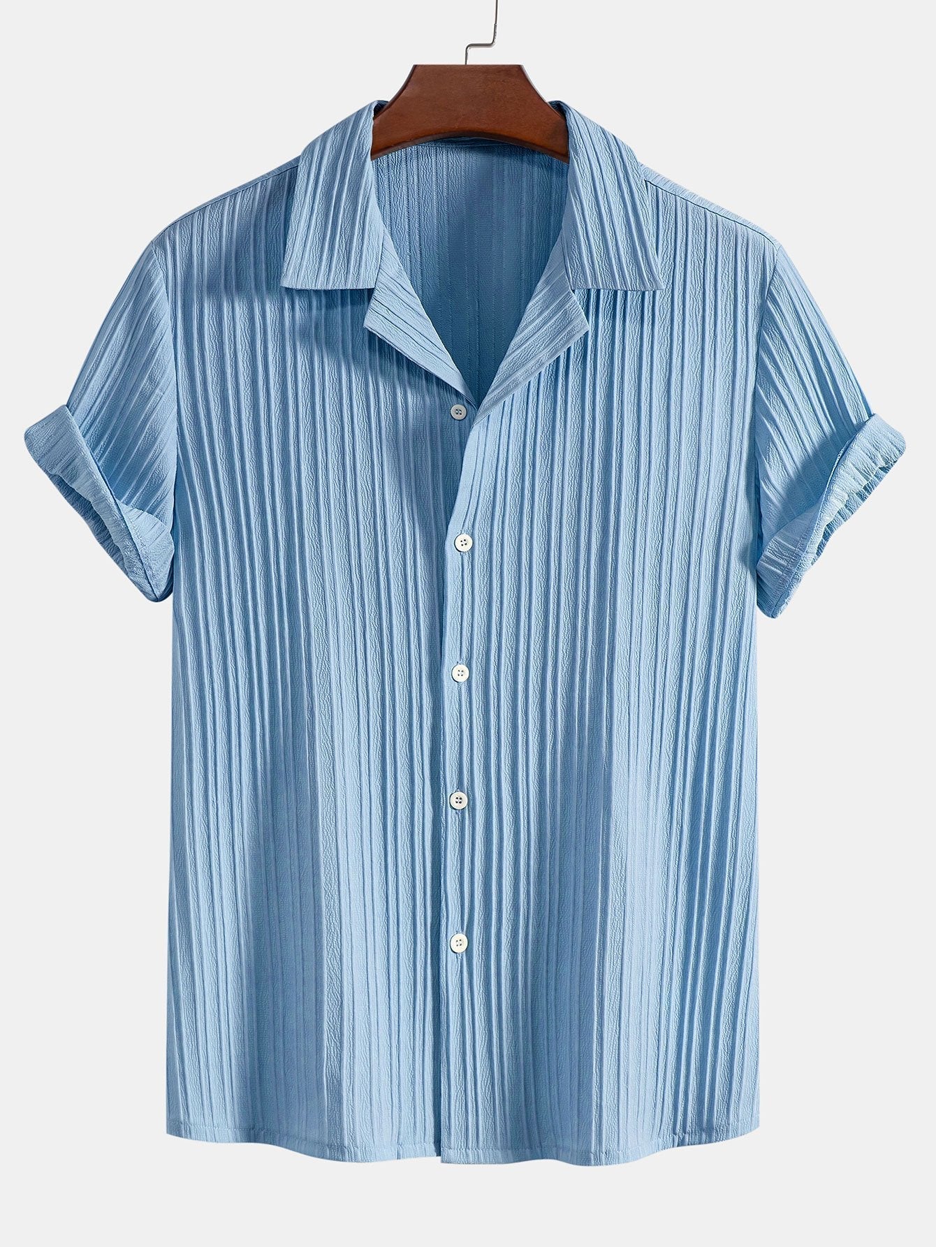 Blue striped shirt on a hanger against a white background