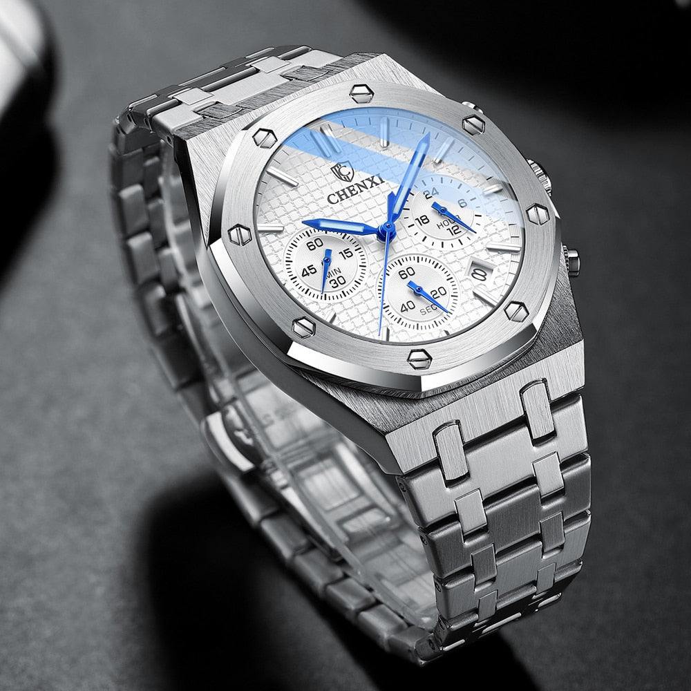 Silver watch with blue accents on a dark background