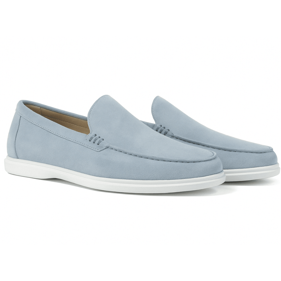 Pair of light blue loafers on a white background