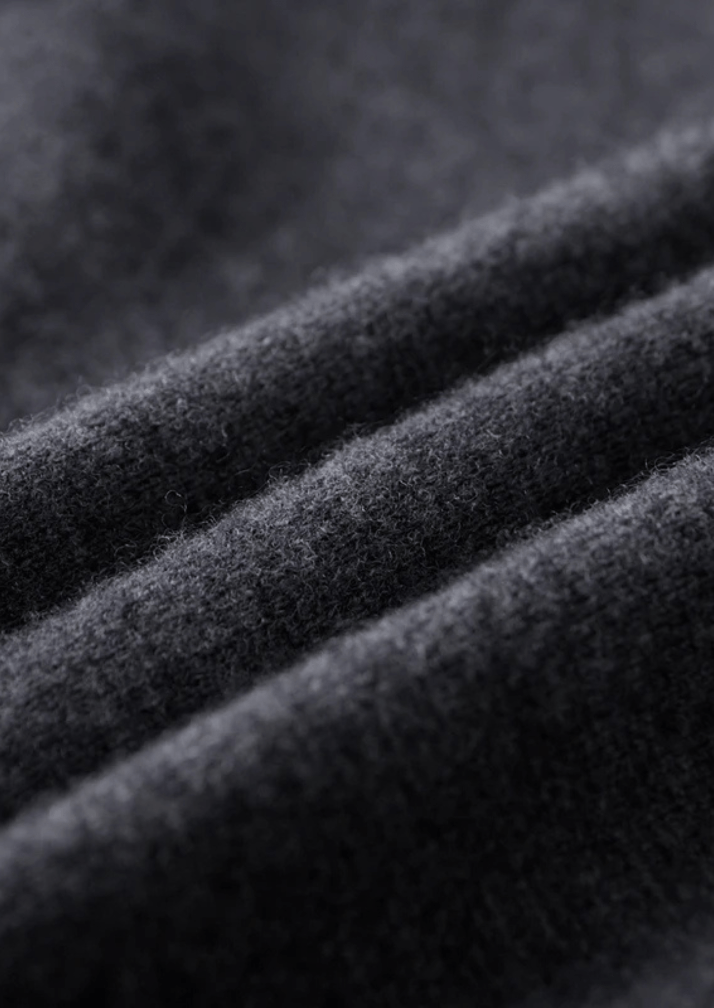 Close-up of dark gray fabric with visible texture