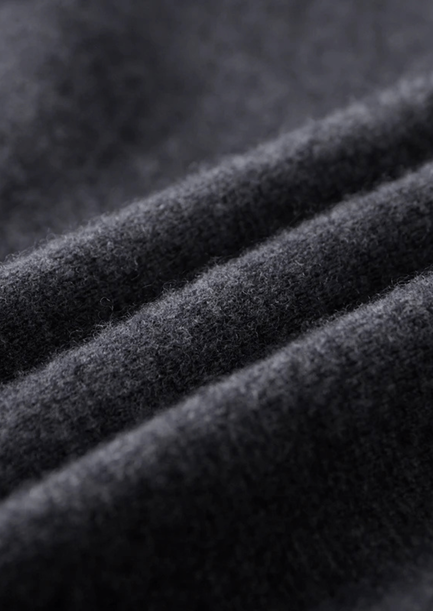 Close-up of dark gray fabric with visible texture