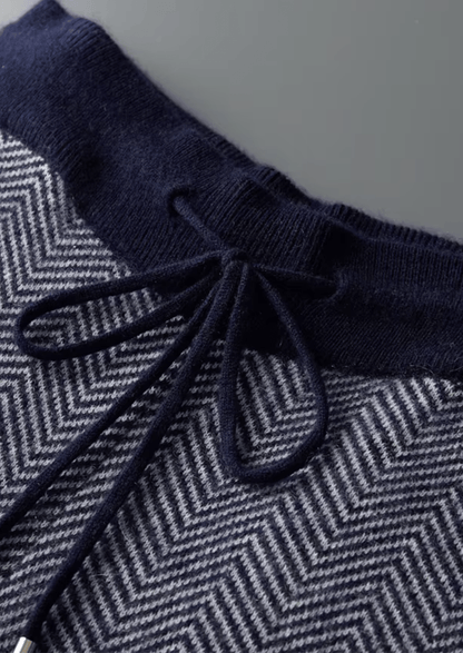 Navy blue and gray herringbone patterned fabric with a drawstring.