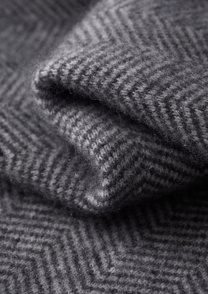 Close-up of folded gray herringbone fabric