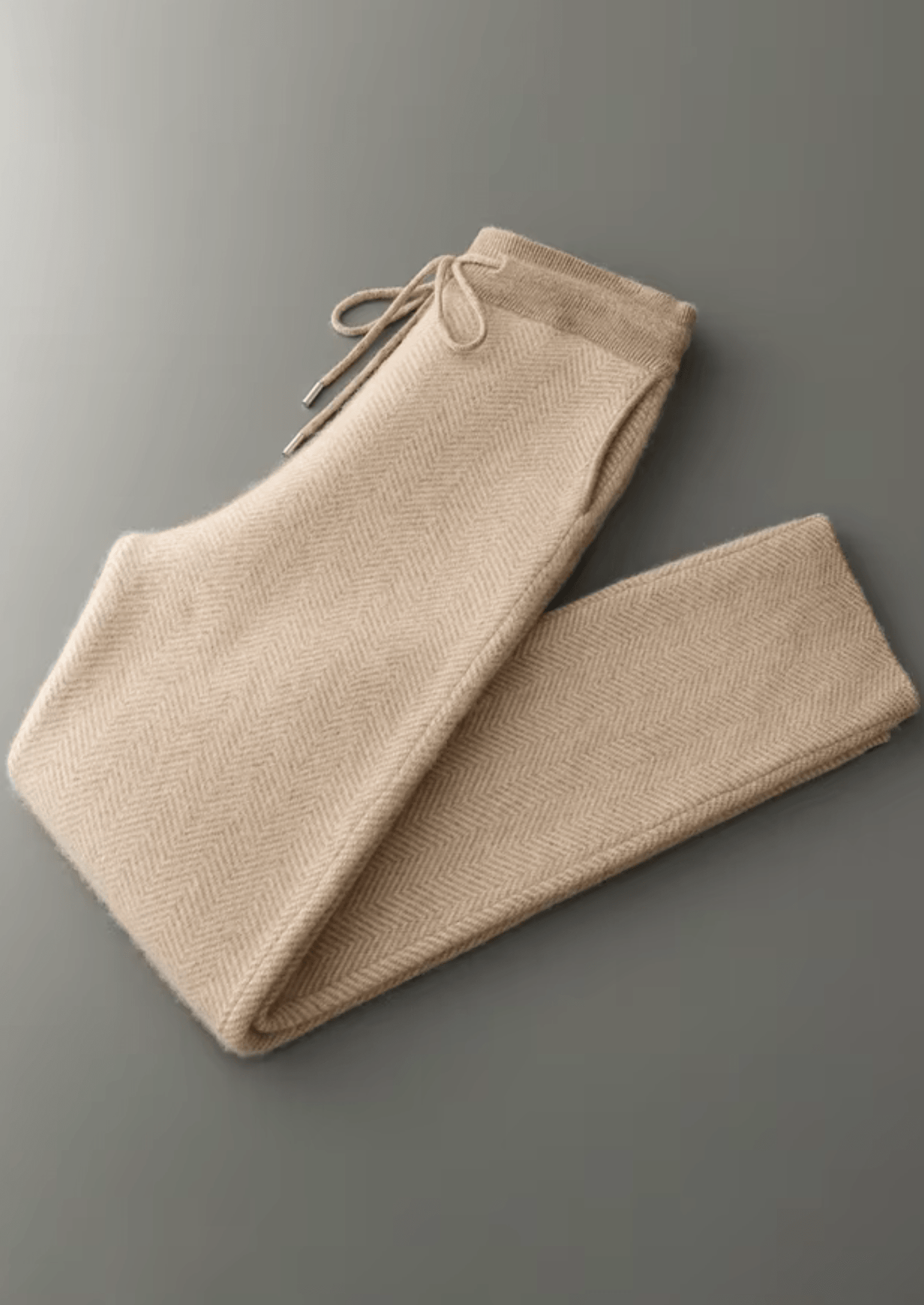 Beige pants on a gray background