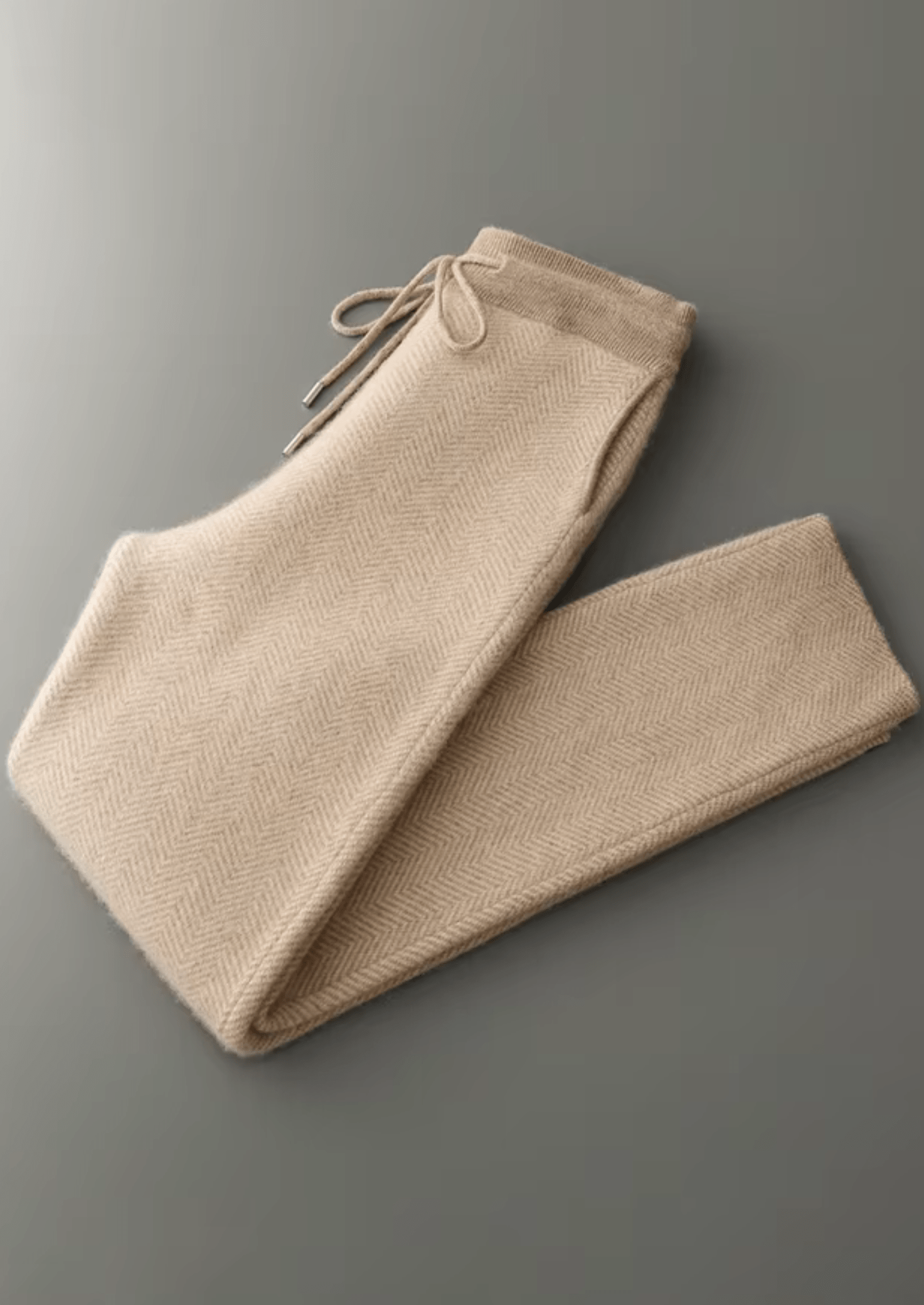 Beige pants on a gray background