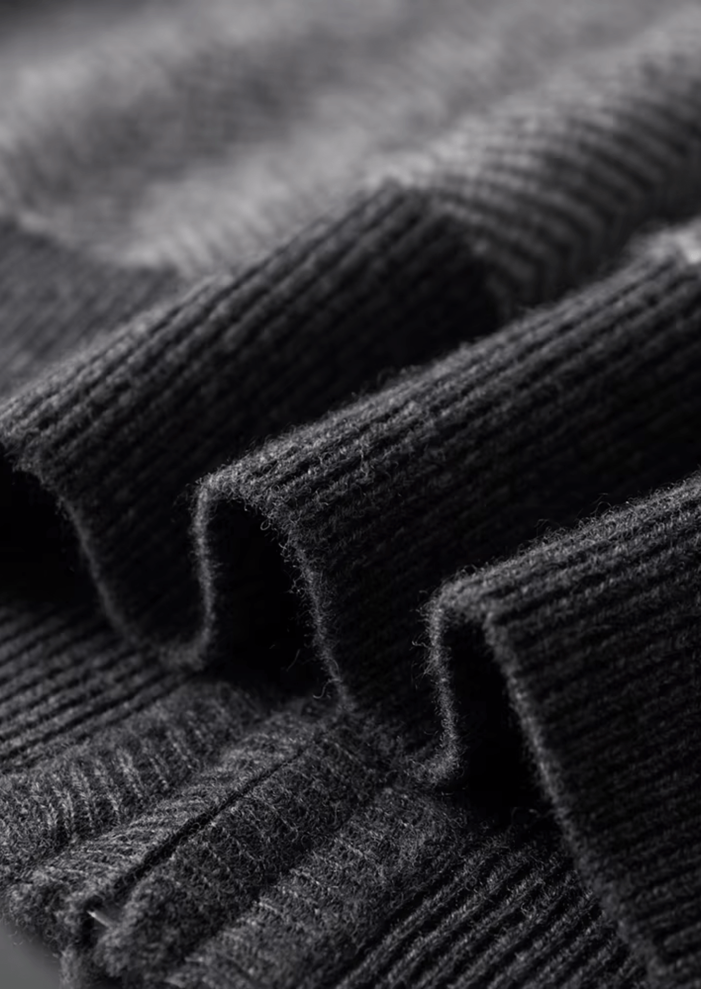 Close-up of ribbed knit fabric in gray color