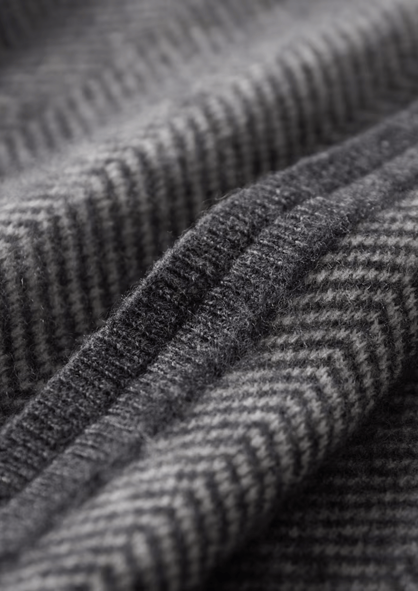 Close-up of textured gray fabric with a subtle pattern