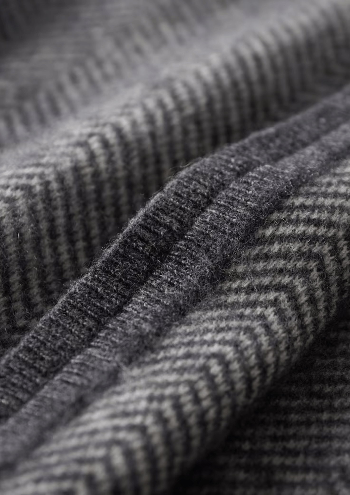 Close-up of textured gray fabric with a subtle pattern