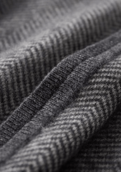 Close-up of textured gray fabric with a subtle pattern