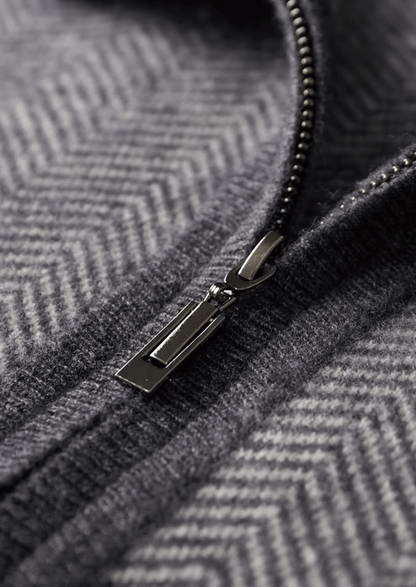 Close-up of a zipper on a textured gray fabric