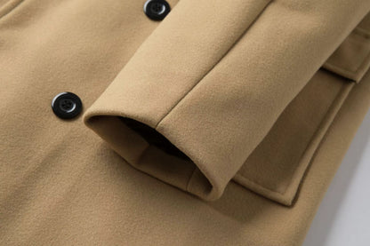 Close-up of a beige coat with black buttons on a white background