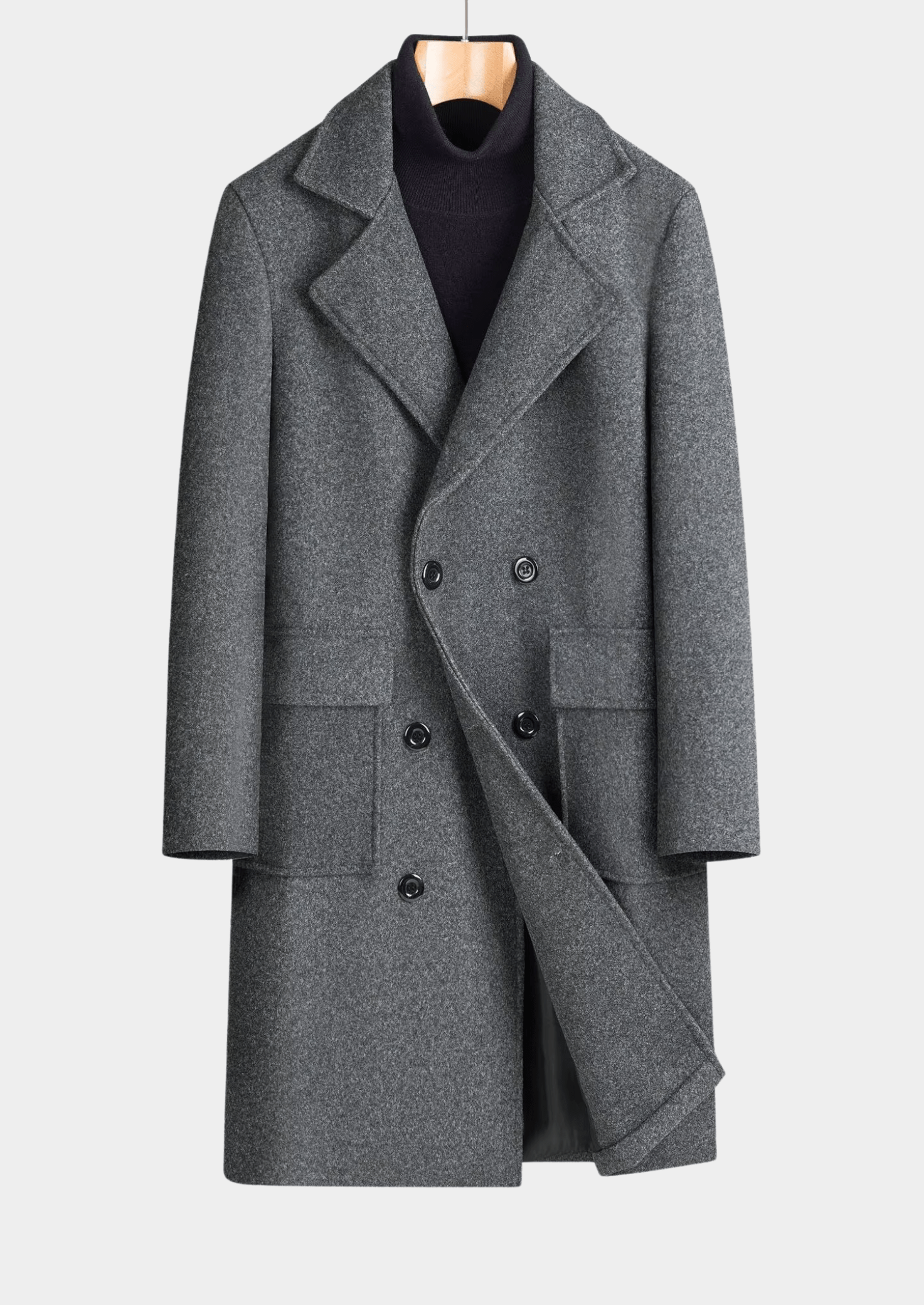 Gray coat on a hanger against a light gray background