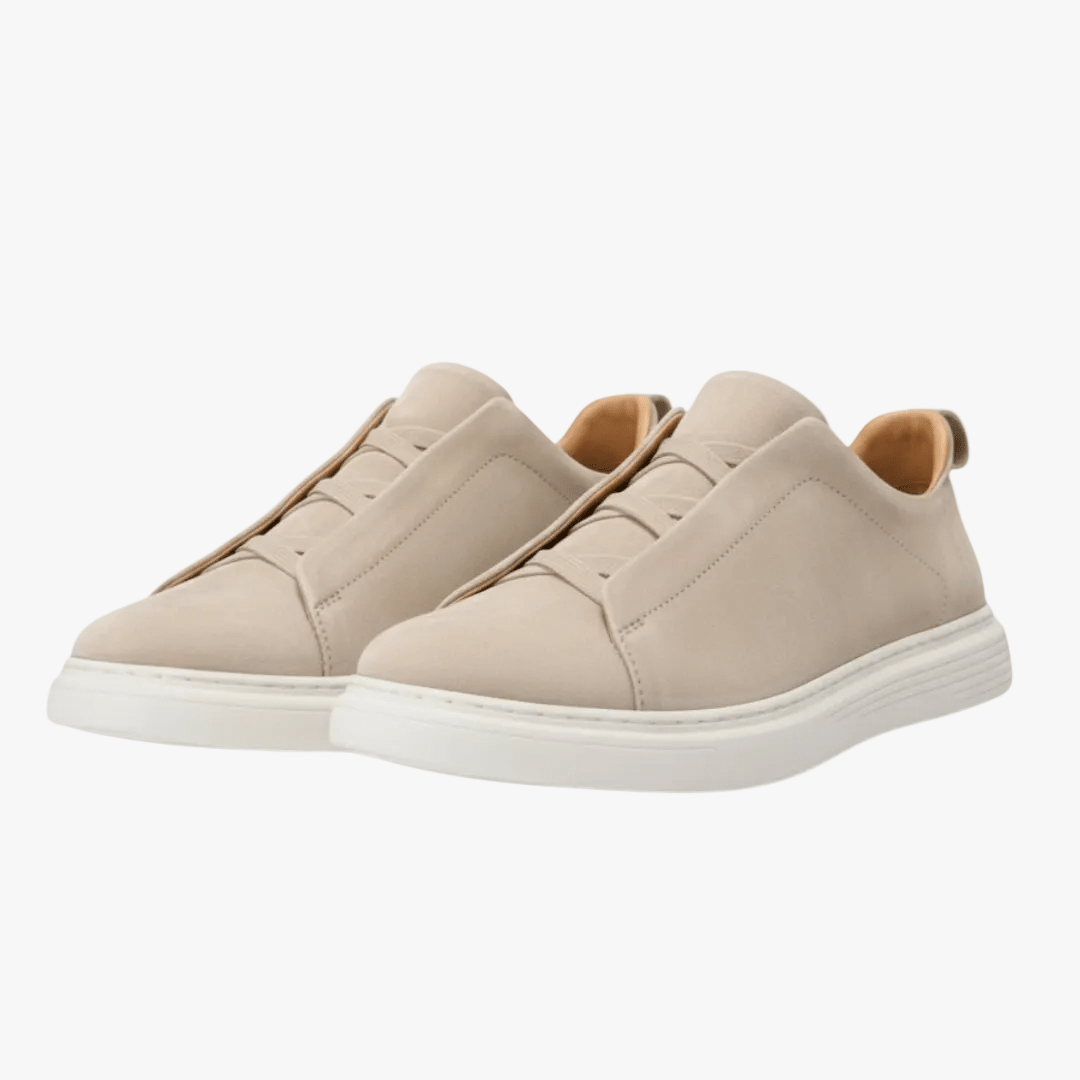 Beige sneakers on a white background