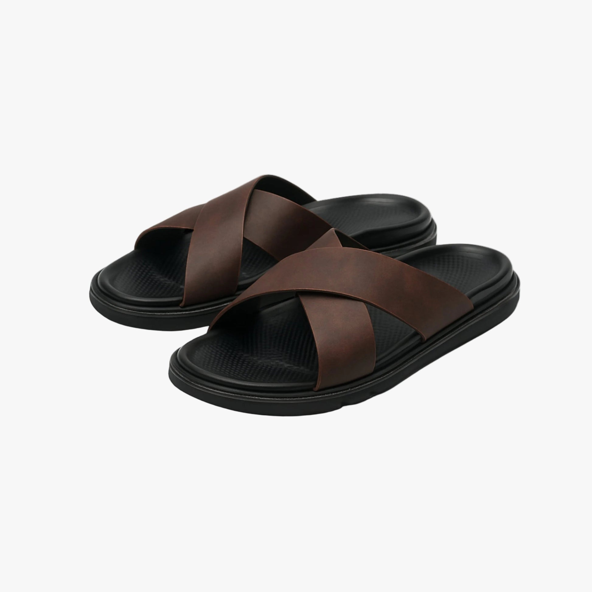 Men's brown NAXOS cross-strap sandal featuring a sleek minimalist design and contoured EVA footbed.