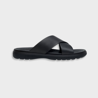 Classic black luxury EVA cross sandal for men, showing the modern silhouette and flexible flat sole.