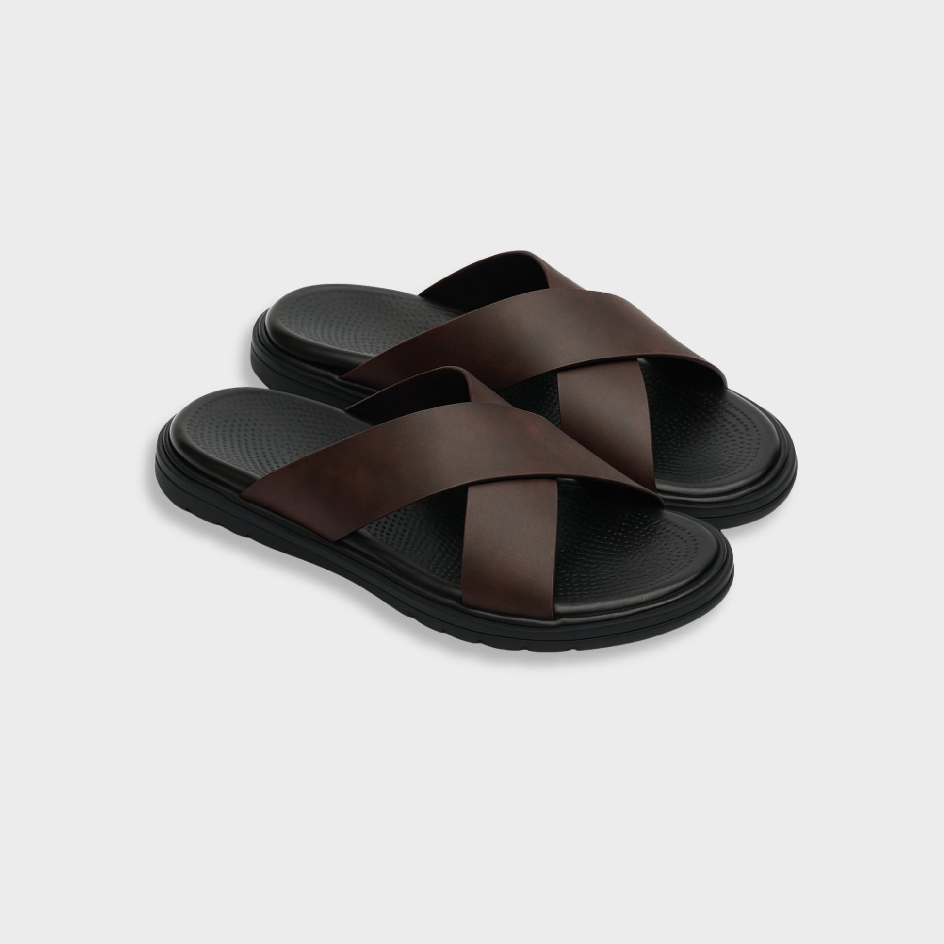 Men's brown NAXOS cross-strap sandal featuring a sleek minimalist design and contoured EVA footbed.