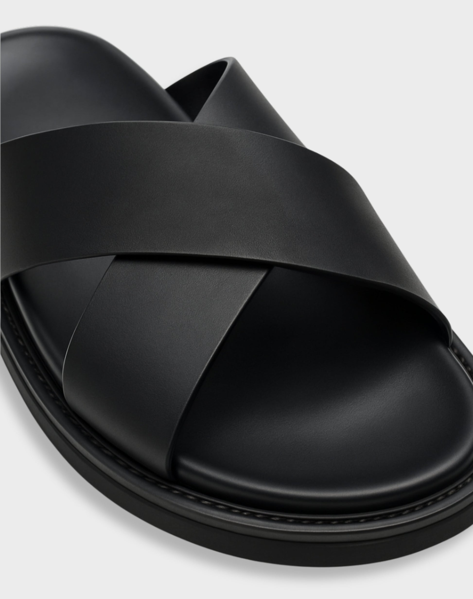 Close-up of the NAXOS sandal's cross-strap texture and ergonomic cushioning for all-day comfort.