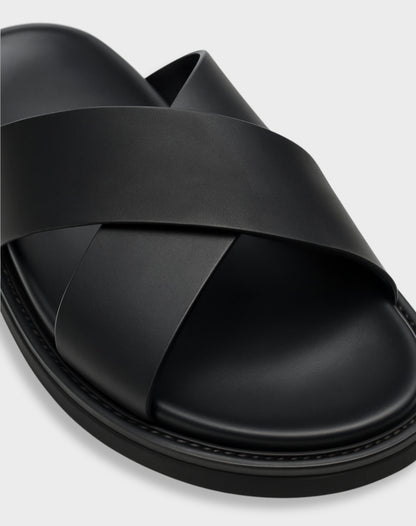 Close-up of the NAXOS sandal's cross-strap texture and ergonomic cushioning for all-day comfort.
