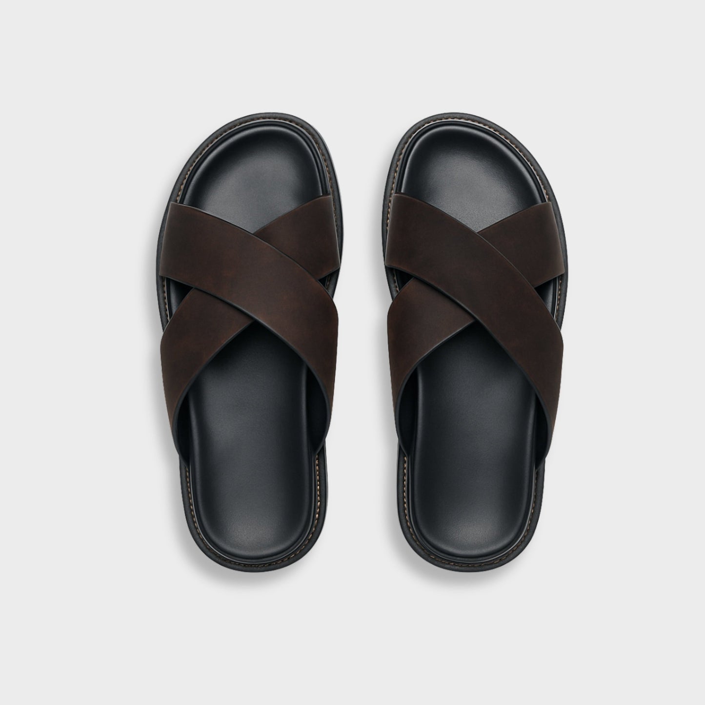 Men's brown NAXOS cross-strap sandal featuring a sleek minimalist design and contoured EVA footbed.