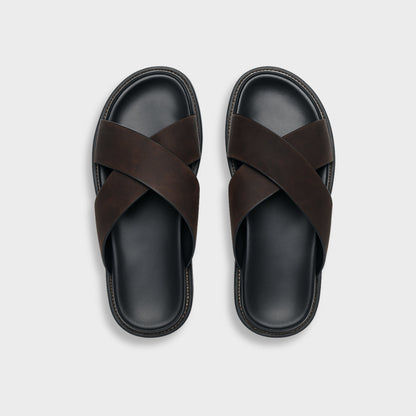 Men's brown NAXOS cross-strap sandal featuring a sleek minimalist design and contoured EVA footbed.