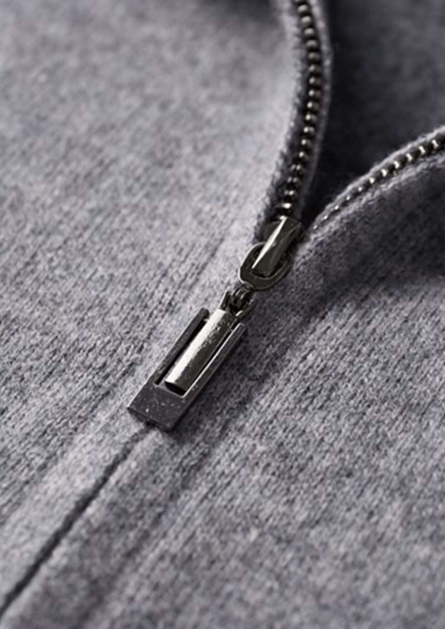 Close-up of a zipper on a gray hoodie