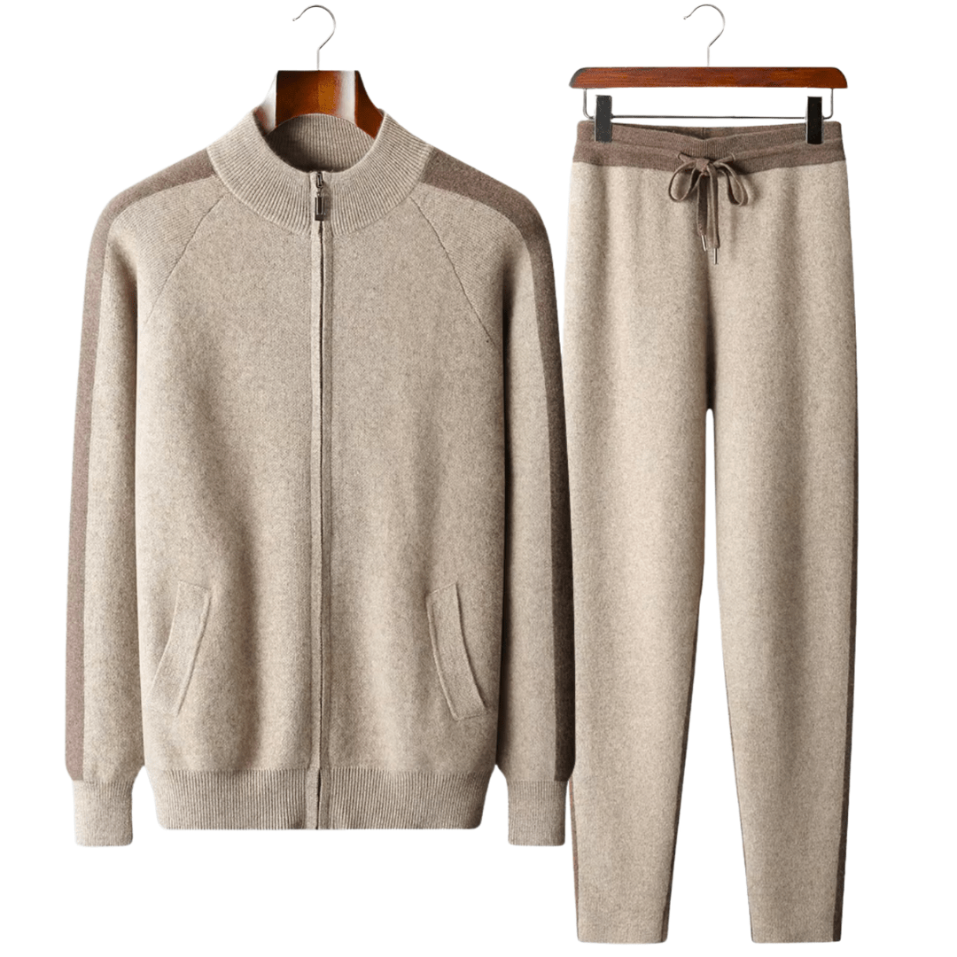 Beige tracksuit with brown accents on hangers against a white background