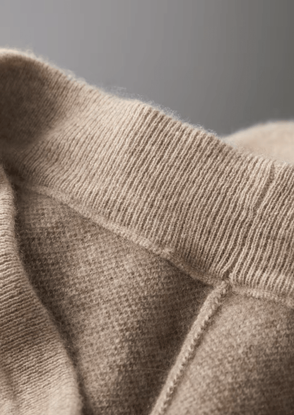 Close-up of beige knitted fabric with a blurred background