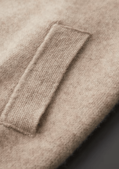Close-up of a beige fabric with a pocket detail