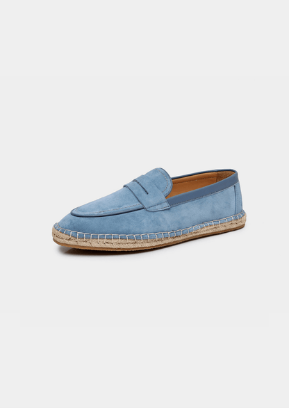 Blue espadrille shoe on a white background