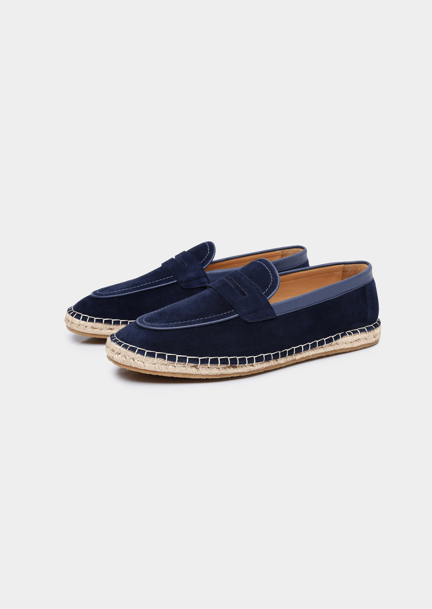 Navy blue suede Seaside Espadrille featuring a leather-trimmed collar and a traditional braided jute midsole with a thin rubber outer sole.