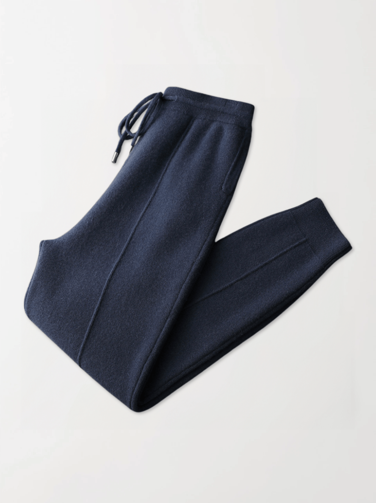Pair of navy blue sweatpants on a light gray background