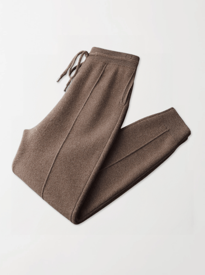 Brown pants with drawstring on a light gray background