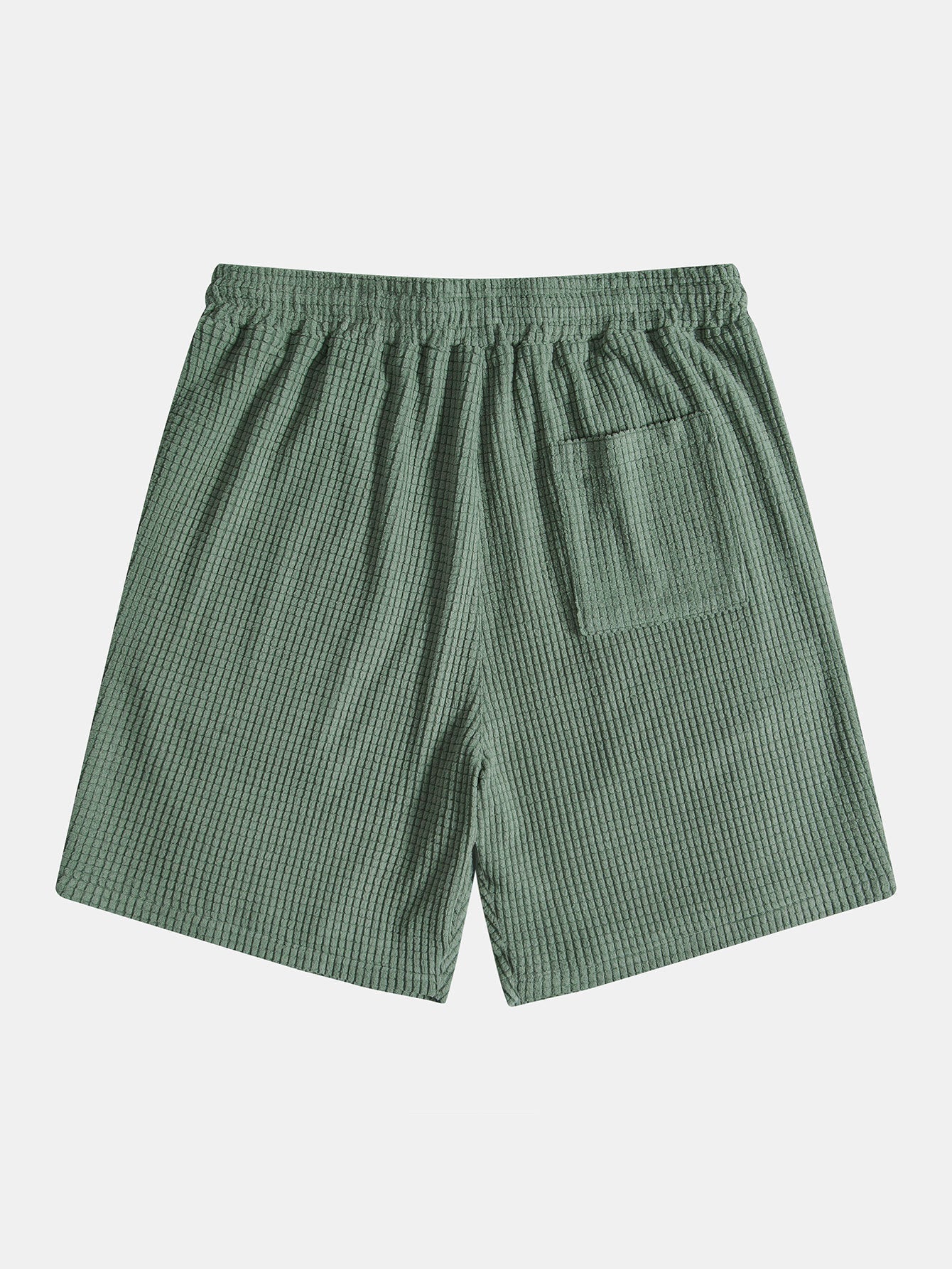 Green checkered shorts on a light gray background