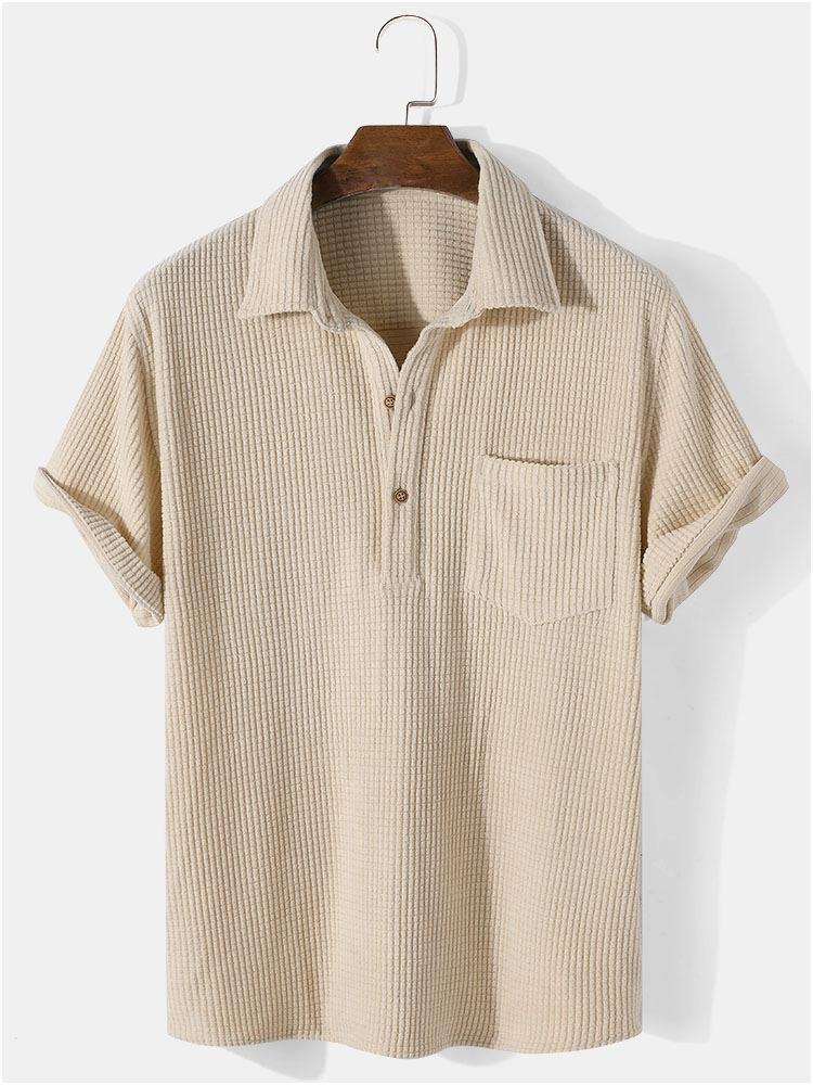 Beige short-sleeve shirt on a hanger against a white background