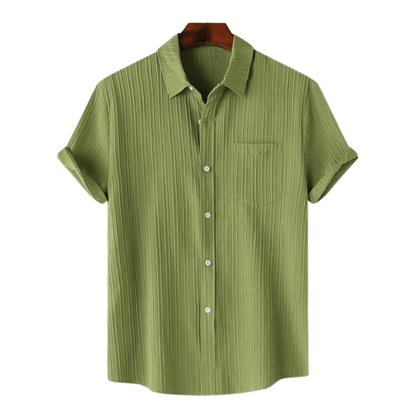 Green striped shirt on a hanger with a white background