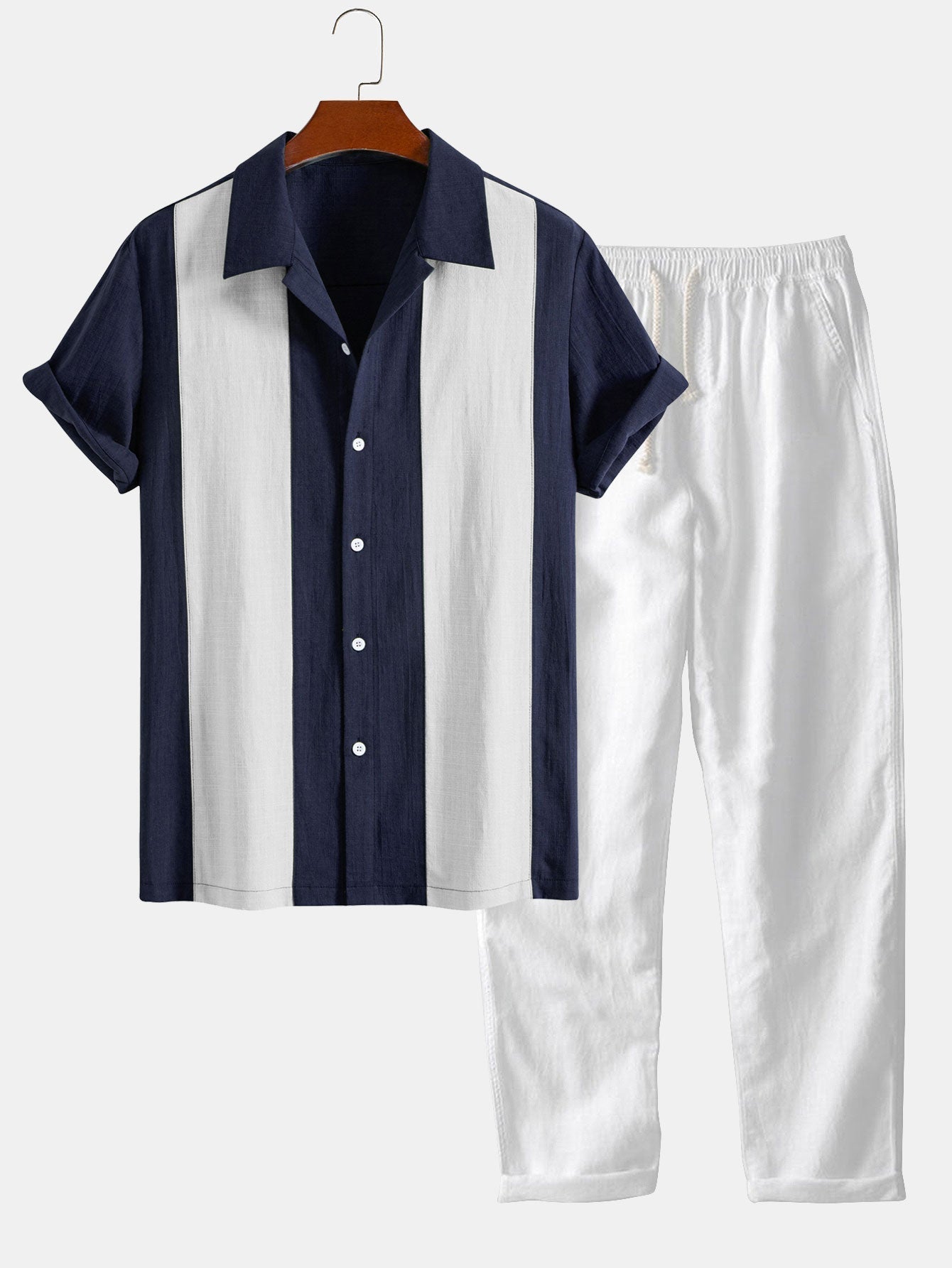 Navy and white shirt and pants set on a hanger against a white background