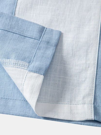 Close-up of a blue and white checkered fabric with a pocket detail.