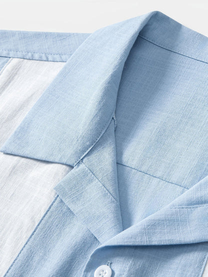 Close-up of a light blue shirt collar on a white background