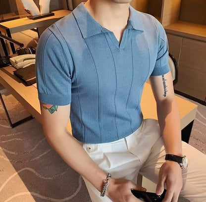 Men's light blue knitted polo featuring a sophisticated vertical ribbed texture and a clean, buttonless V-neckline.