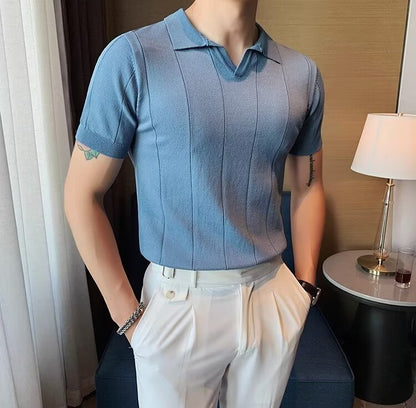 Men's light blue knitted polo featuring a sophisticated vertical ribbed texture and a clean, buttonless V-neckline.