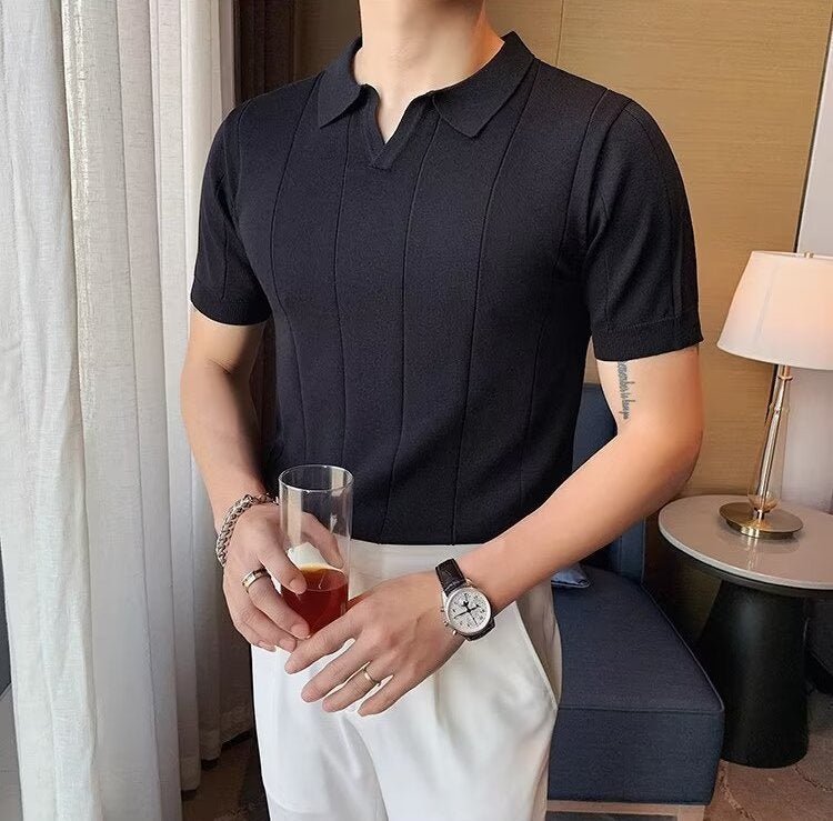 Premium Men's black vertical ribbed polo showcasing a streamlined linear design and a tailored, contemporary fit.